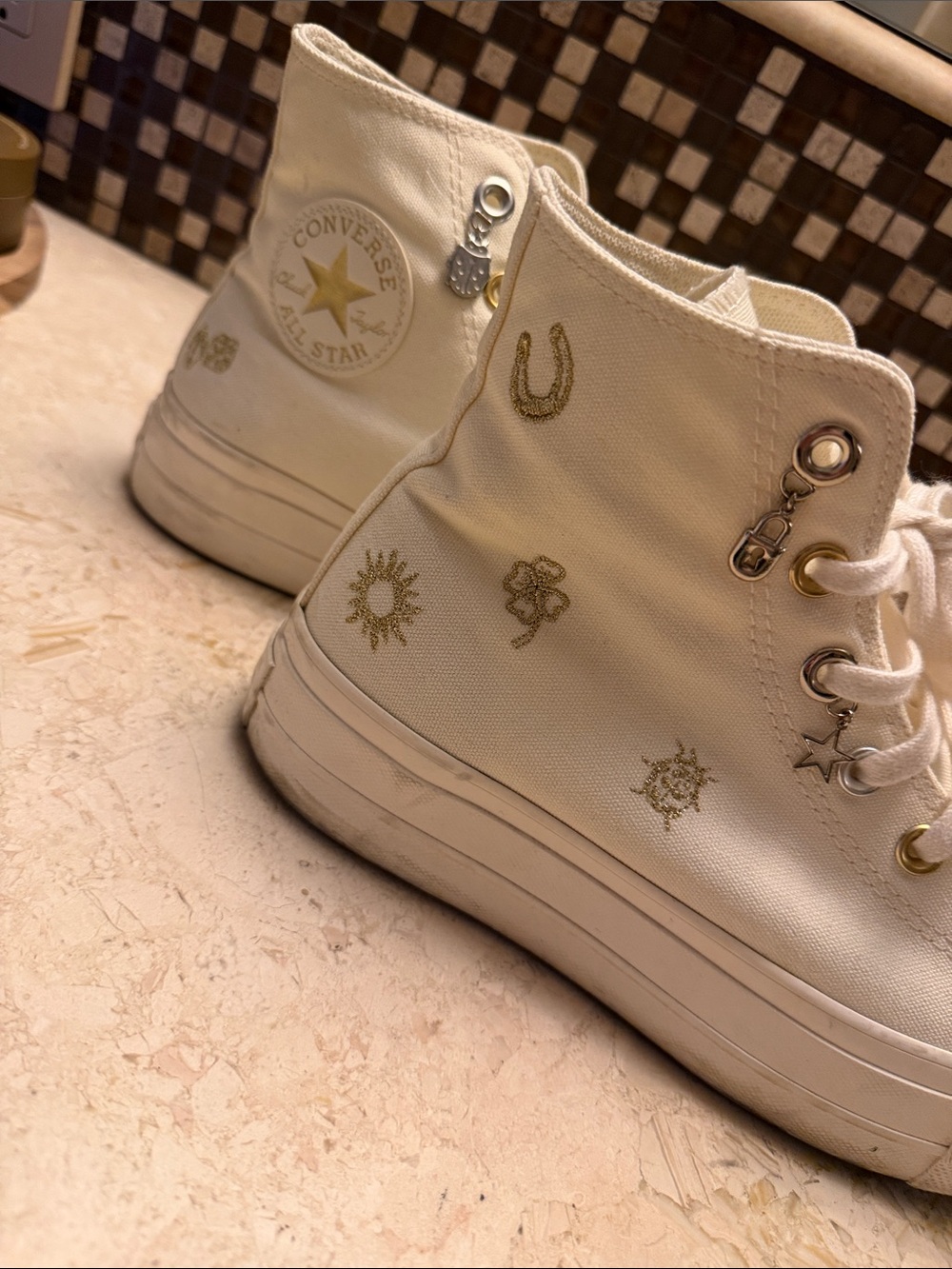 Converse women’s Cream High-Top Sneakers with Gold Accents 8